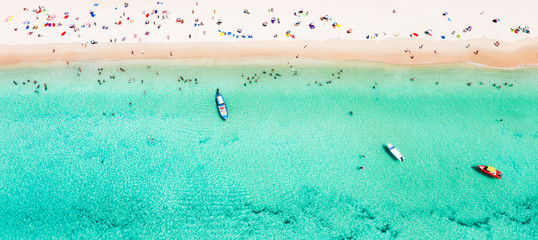 View from above, stunning aerial view of a beautiful tropical beach with white sand and turquoise...