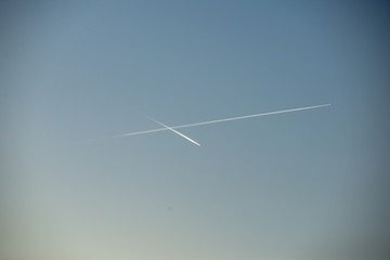 plane leaving smoke trail in the sky