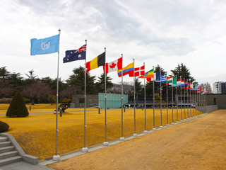 National Flags Waving in the air of UN Memorial Cemetery in Busan, South Korea, Asia