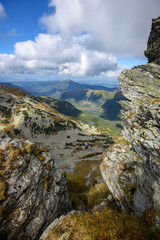 Tatra mountain peaks with tourist hiking trails in sunny summer day