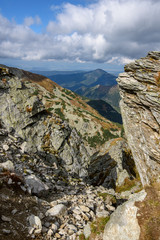 Tatra mountain peaks with tourist hiking trails in sunny summer day