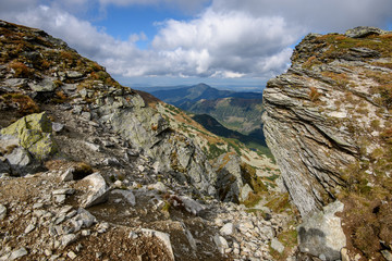 Tatra mountain peaks with tourist hiking trails in sunny summer day