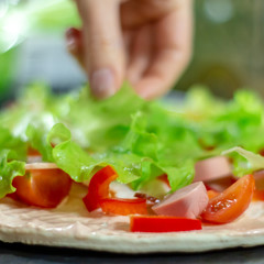 Food ingredients for pizza on table close up, cooking homemade pizza with fresh vegetables