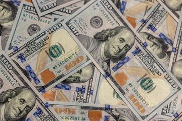 Pile of new design US dollar bills as background. Top view point