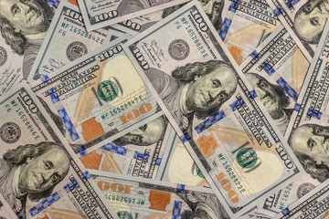 Pile of new design US dollar bills as background. Top view point