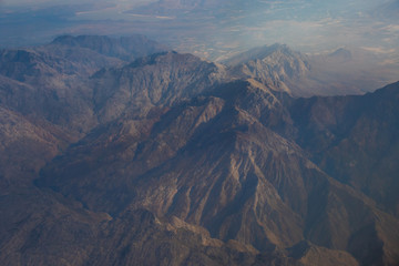 View from an aircraft window travelling high above the clouds image for background use with copy space in landscape format