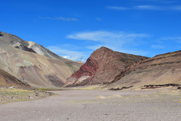  Tibetan mountains on the way to lake Mershung in summer in clear weather. On sorrow is read face mythical beings