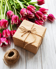 Fototapeta na wymiar Gift box and tulips bouquet