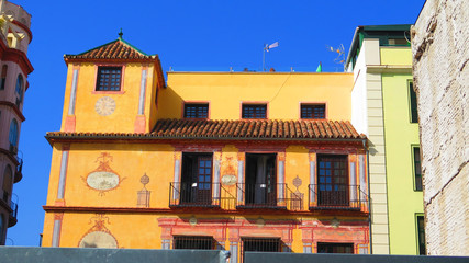 Sun shining on old Malaga building