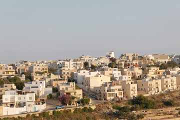 Fototapeta na wymiar Cityscape of typical buildings in a suburb to Valletta in Malta
