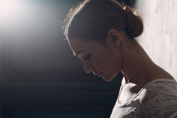 Edge lit profile woman portrait.