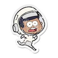 distressed sticker of a cartoon surprised astronaut