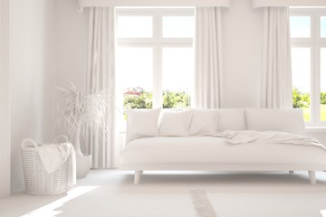 Stylish room in white color with sofa and green landscape in window. Scandinavian interior design. 3D illustration