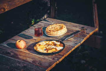 Fried eggs with bacon and pancakes. Country breakfast.