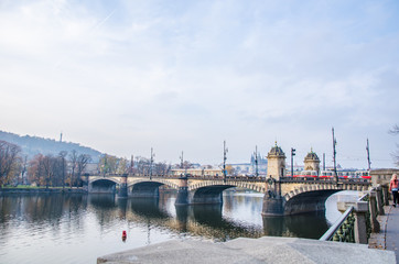 Fototapeta premium The Vltava river, The Vltava river, Charles bridge and white swans in Prague, Czech Republic in Prague, Czech Republic
