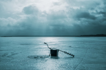 Fishing tackle on the ice of the lake. Ice fishing.