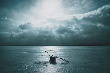 Fishing tackle on the ice of the lake. Ice fishing.