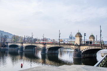 Fototapeta na wymiar The Vltava river, The Vltava river, Charles bridge and white swans in Prague, Czech Republic in Prague, Czech Republic
