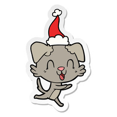 laughing sticker cartoon of a dog wearing santa hat