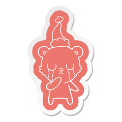 crying polar bear cartoon  sticker of a wearing santa hat