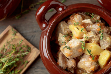  Meat stewed with potatoes, carrots and spices .