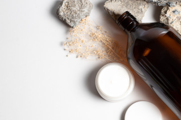 bottle glass container package product mockup with set of spa aromatic oil and beauty cosmetic treatment concept top view