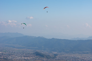 Parasailor Floating over a City