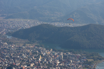 Parasailor Floating over a City