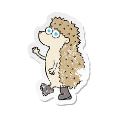 retro distressed sticker of a cute cartoon hedgehog