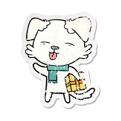 distressed sticker of a cartoon dog with xmas gift