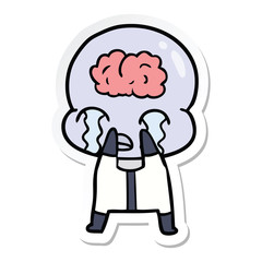 sticker of a cartoon big brain alien crying