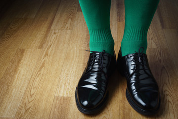 A man in green socks and shoes, St. Patrick's Day