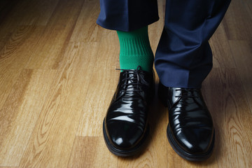 A man in green socks and a blue suit, joke, St. Patrick's Day
