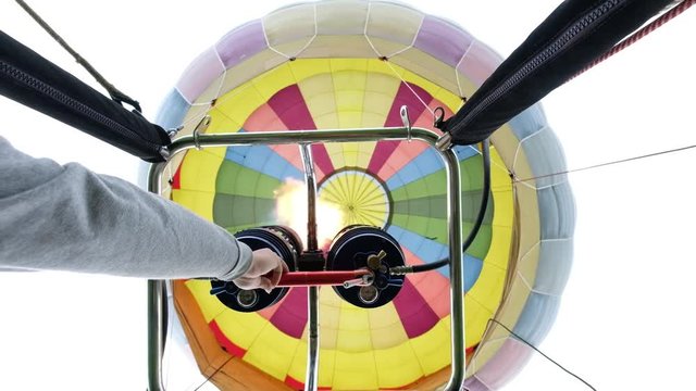 Hot air balloon with gas power accelerators, taking off