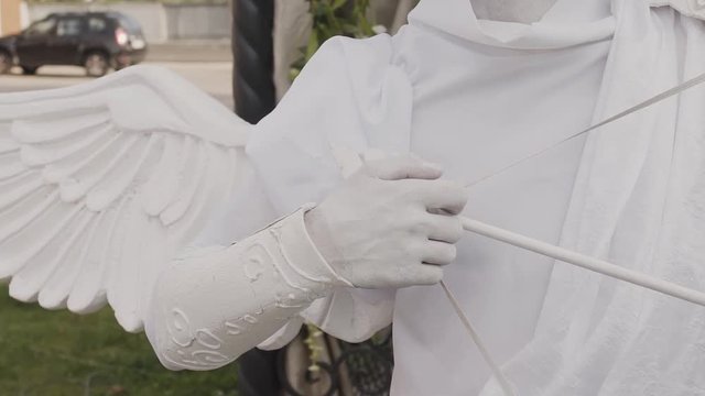 White mime Cupid on holiday, close-up.
