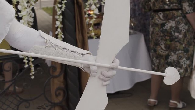 White mime Cupid on holiday, close-up.