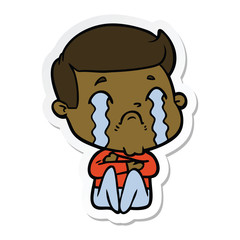 sticker of a cartoon man crying