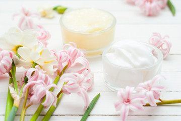 Moisturizers with hyacinth and daffodil flowers