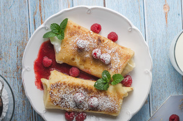 Cheese blintzes pancakes with fresh fruit