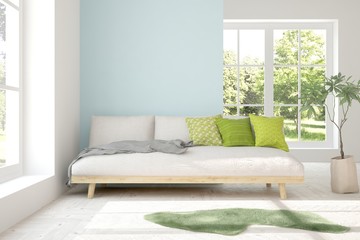 White stylish minimalist room with sofa and summer landscape in window. Scandinavian interior design. 3D illustration