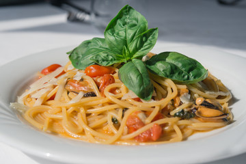 Spaghetti mussels, tomato, basil and cheese: italian food