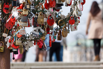 Many love locks hang on the newlyweds tree, a symbol of love and loyalty at the Tretyakov Bridge in Moscow, Russia hang on a wedding tree, on a tree of newlyweds on the Tretyakov Bridge in Moscow