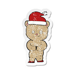 retro distressed sticker of a cartoon christmas teddy bear