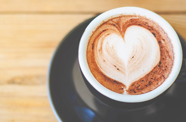 Coffee cup on the table in the cafe.In a cafe with a cup of coffee.Do not focus on objects.