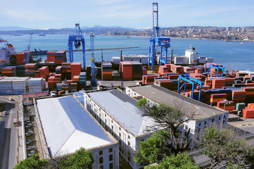 Loading of the container vessel in the city port. Valparaiso, Chile.