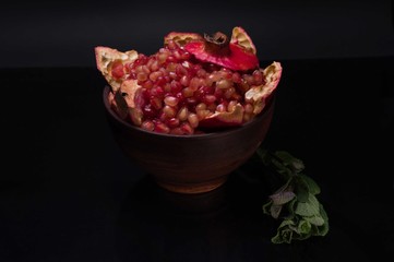 Still life of pomegranate. Still life of pomegranate and mint.