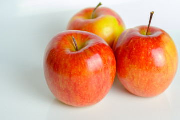 Three red apples of Fuji variety