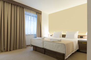 Fototapeta na wymiar Interior of a modern new hotel bedroom