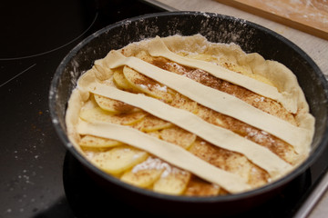 apple pie on black baking dish