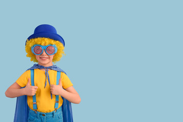 Little boy superhero shows gesture ok